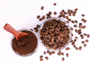 Ground coffee and roasted coffee beans in a bowl on a white background. Flat lay.
