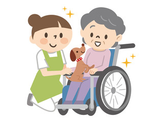 アニマルセラピー　動物とふれあうシニア女性と介護士