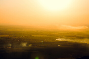 Beautiful yellow sunset in the field