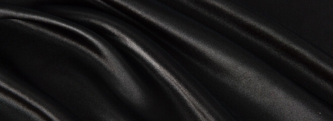 Fototapeta premium Black luxury fabric background with copy space