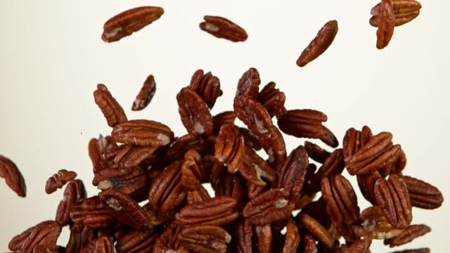 Super Slow Motion Shot of Flying Natural Pecan Nuts. Filmed on High Speed Cinematic camera at 1000 fps.