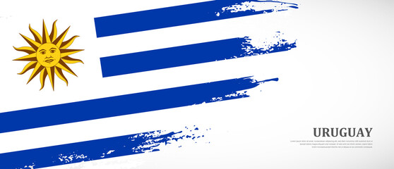 National flag of Uruguay with textured brush flag. Artistic hand drawn brush flag banner background