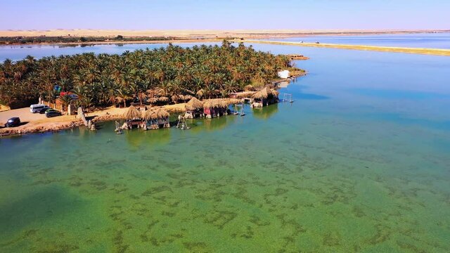 Aerial Panning Idyllic Shot Of Shades In Siwa Salt Lake On Sunny Day - Siwa Oasis, Egypt