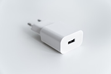 AC charger with USB connector for smartphone or tablet on a white background.