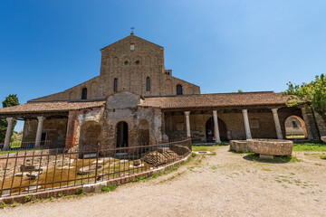 Facade of the Basilica and Cathedral of Santa Maria Assunta in Venetian-Byzantine style (639) in Torcello island, one of the oldest churches in Venice, UNESCO world heritage site, Veneto, Italy. 