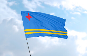 Flag of Aruba, realistic 3d rendering in front of blue sky