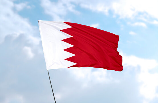 Flag of Bahrain, realistic 3d rendering in front of blue sky
