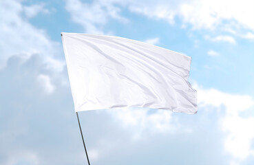 White flag, realistic 3d rendering in front of blue sky