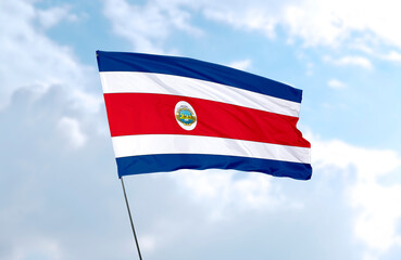 Fototapeta na wymiar Flag of Costa Rica, realistic 3d rendering in front of blue sky