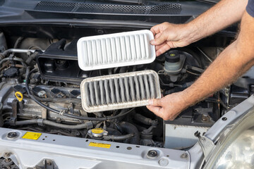 Replacing the dirty engine air filter for a car