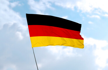 Flag of Germany, realistic 3d rendering in front of blue sky