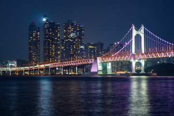 Fototapeta premium Gwangan Bridge and skyscrapers in the night. Busan, South Korea