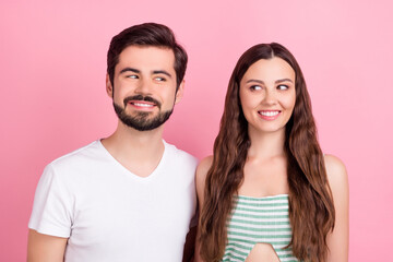 Photo of cunning playful couple look each other toothy smile wear casual outfit isolated pink color background