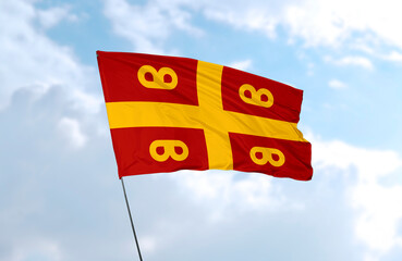 Flag of the Byzantine Empire, realistic 3d rendering in front of blue sky