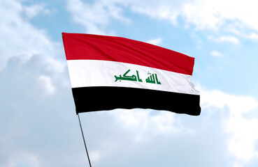 Flag of Iraq, realistic 3d rendering in front of blue sky