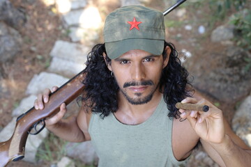 Revolutionary man holding a weapon and smoking a cigar