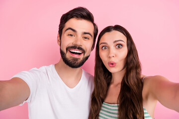 Photo of positive blogger couple take selfie posing wear casual outfit isolated pink color background