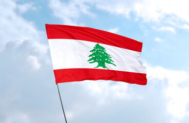 Flag of Lebanon, realistic 3d rendering in front of blue sky