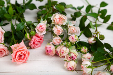 Pink roses on a wooden background.