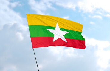 Flag of Myanmar, realistic 3d rendering in front of blue sky