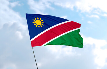 Flag of Namibia., realistic 3d rendering in front of blue sky