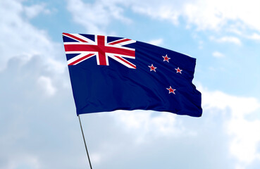 Flag of New Zealand, realistic 3d rendering in front of blue sky