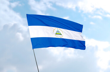 Flag of Nicaragua, realistic 3d rendering in front of blue sky