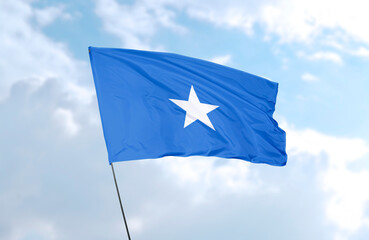 Flag of Somalia, realistic 3d rendering in front of blue sky