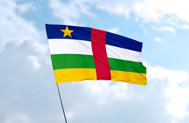 Flag of the Central African Republic, realistic 3d rendering in front of blue sky