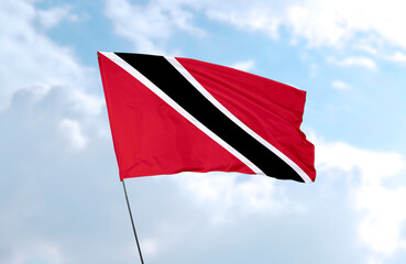 Flag of Trinidad and Tobago, realistic 3d rendering in front of blue sky