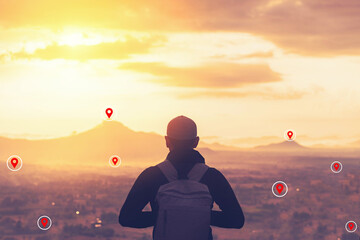 Backpacker man standing at top of mountain looking view landscape with navigator gps location...