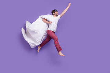 Full body profile photo of excited overjoyed person raise fist look empty space isolated on purple...