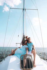 happy family mom dad son sailing on a yacht on a joint weekend. sea vacation.