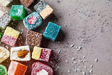 Turkish delight of different types, dark background.