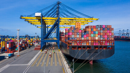 Aerial view commercial dock seaport warehouse and crane ship, Container ship at industrial port...