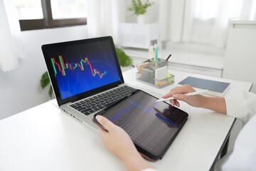 Investor trading crypto currencies online work at home. chart suitable for Stock market forex or cryptography trading financial investment graphs Finance Economy Trading Stock 