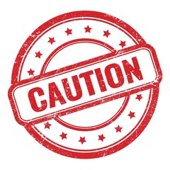 CAUTION text on red grungy vintage round stamp.