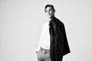Obraz premium man with a jacket over his shoulders fashion studio lifestyle model