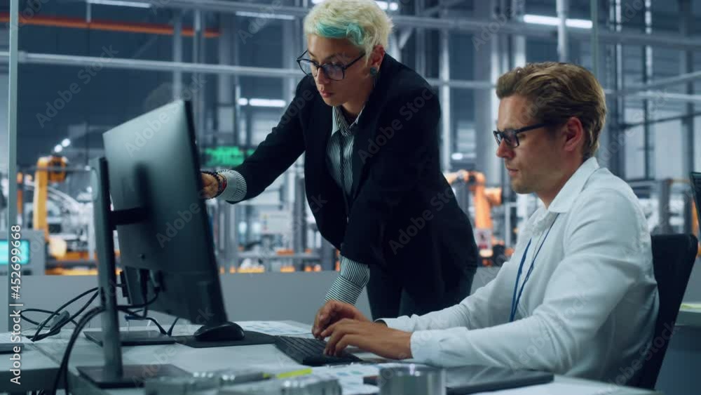 Aufkleber Two Automotive Engineers Discussing Concept Car Blueprints on Desktop Computer in Modern Office at Assembly Plant. Female Industrial Project Manager Talk to Male Designer at Vehicle Factory.