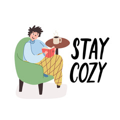 Winter, Christmas card, banner with lettering Stay cozy. Young guy sitting in chair, reading book, drinking a coffee.