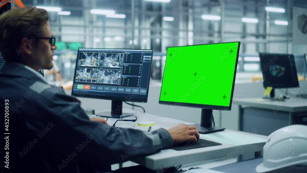 Fototapete African American Engineer Using Laptop Computer and Looking Out of the Office at a Car Assembly Plant. Vehicle Factory Line Operator Working at Desk with Computer with Green Screen Display.