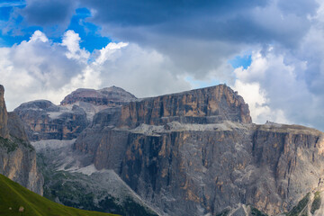 Scenery in the Dolomite Mountains in summer, with dramatic storm clouds
