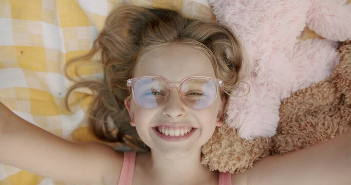 Portrait teenage Girl Looking at Camera give virtual kisses with hand top view
