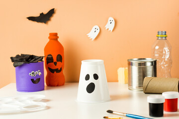 DIY for kids. Halloween home activities. Handmade toys monster, ghost and pumpkin. Reuse concept art from plastic cup