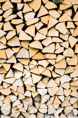 Pile of wood forming a wall. Ecology and deforestation problems in nature.