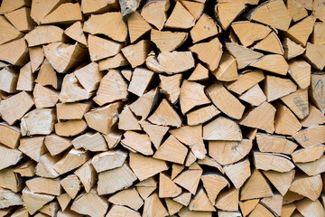 Pile of wood forming a wall. Ecology and deforestation problems in nature.