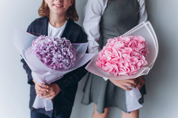 Two bouquets in girl's hands