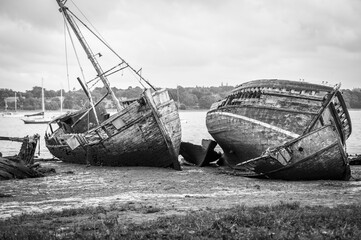 Old abandoned shipwrecks on the river bank