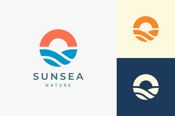 Beach or coast logo in simple sun and ocean shape