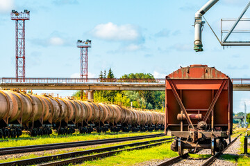 Railway wagon standing near the elevator in agriculture zone - obrazy, fototapety, plakaty